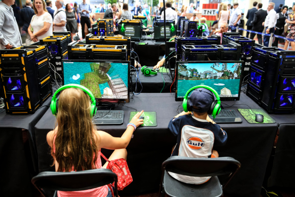 ASCOT, ENGLAND - AUGUST 09:  Young racegoers play in a Minecraft tournament during Ascot Dubai Duty Free Shergar Cup and Concert at Ascot Racecourse on August 9, 2014 in Ascot, England.  (Photo by Miles Willis/Getty Images for Ascot Racecourse)